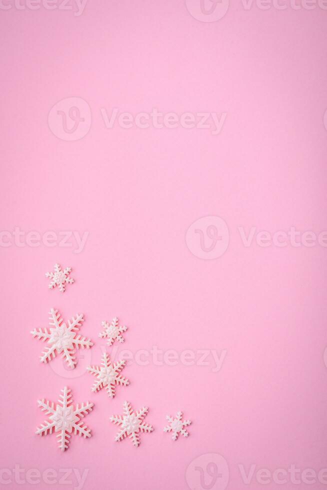 Beautiful winter snowflakes on a plain background with copy space photo