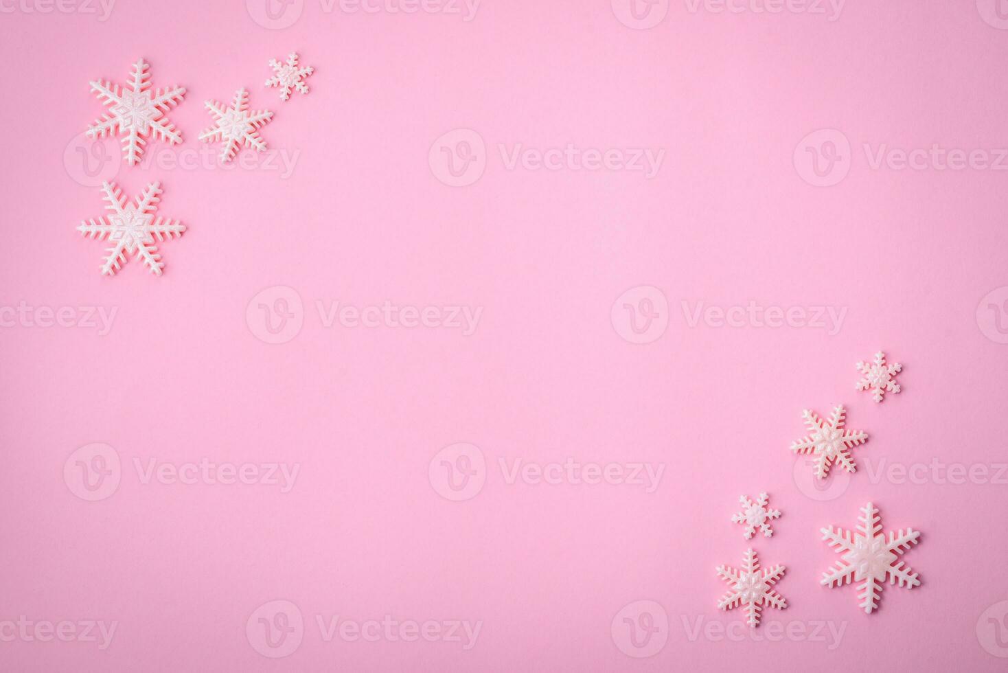 Beautiful winter snowflakes on a plain background with copy space photo