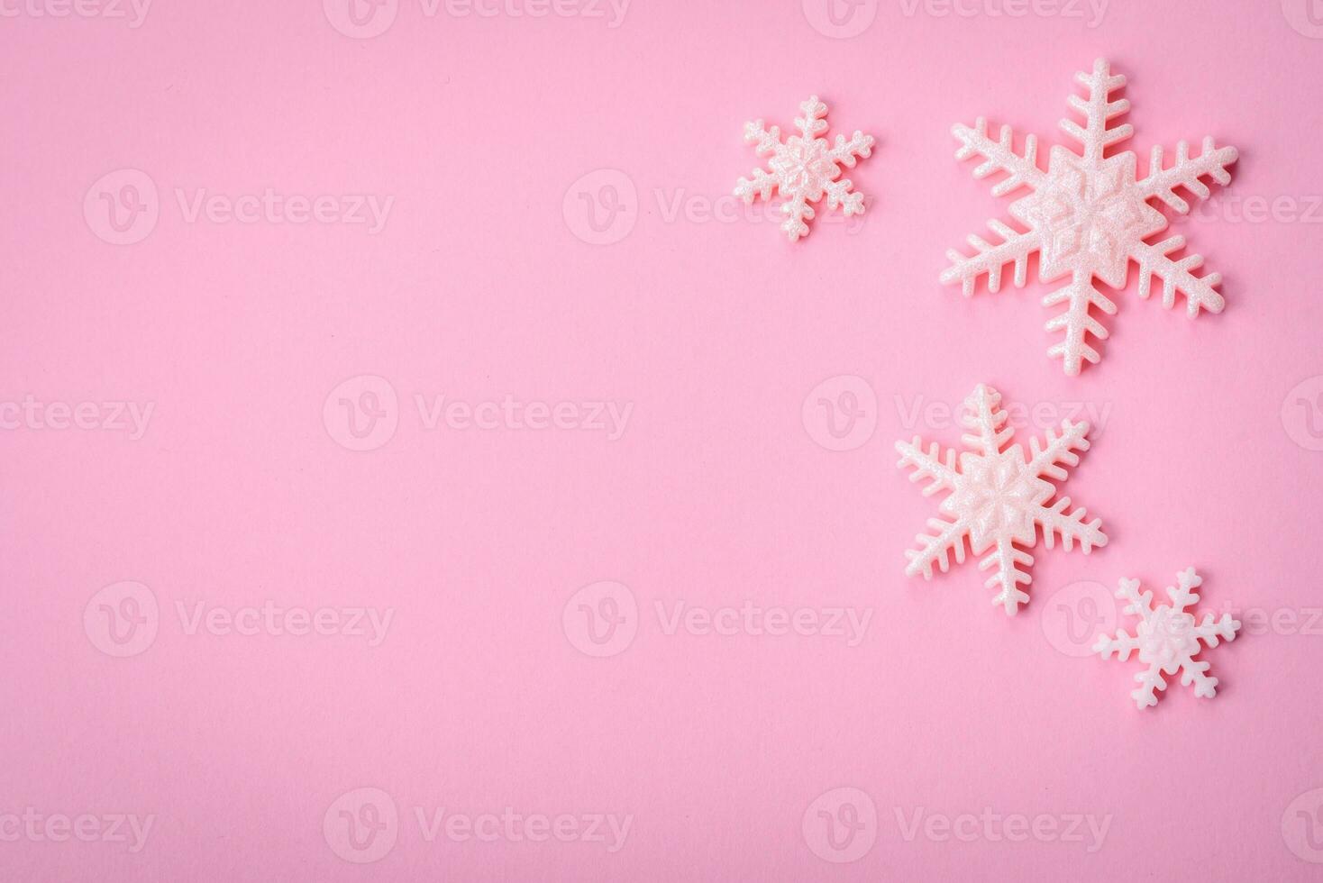 Beautiful winter snowflakes on a plain background with copy space photo