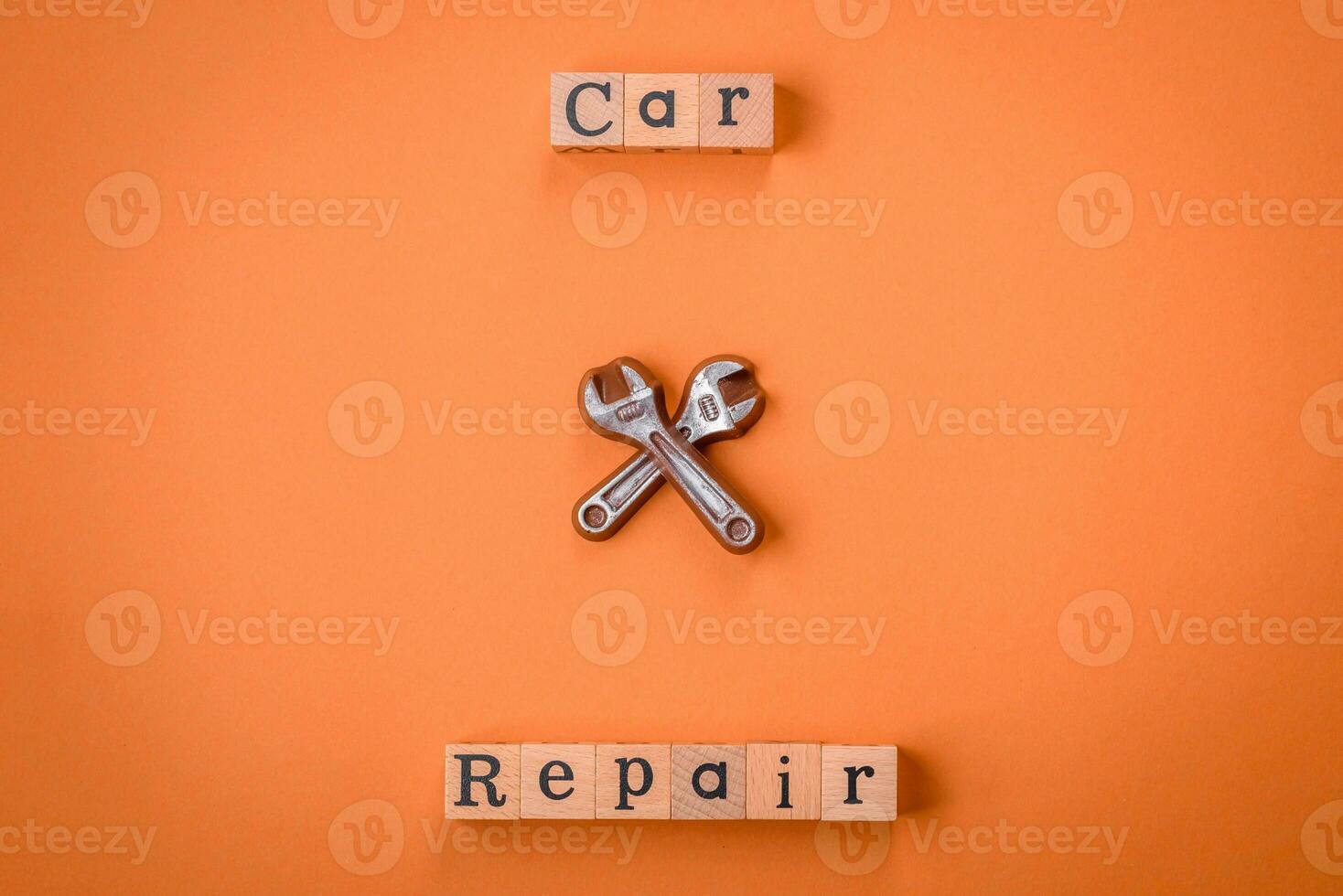 Tools and inscriptions symbolizing repairs or a garage and its attributes on a plain background photo