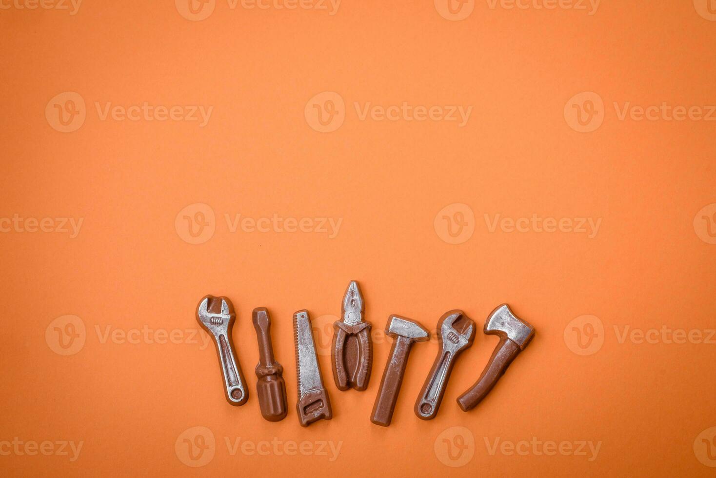 Tools and inscriptions symbolizing repairs or a garage and its attributes on a plain background photo