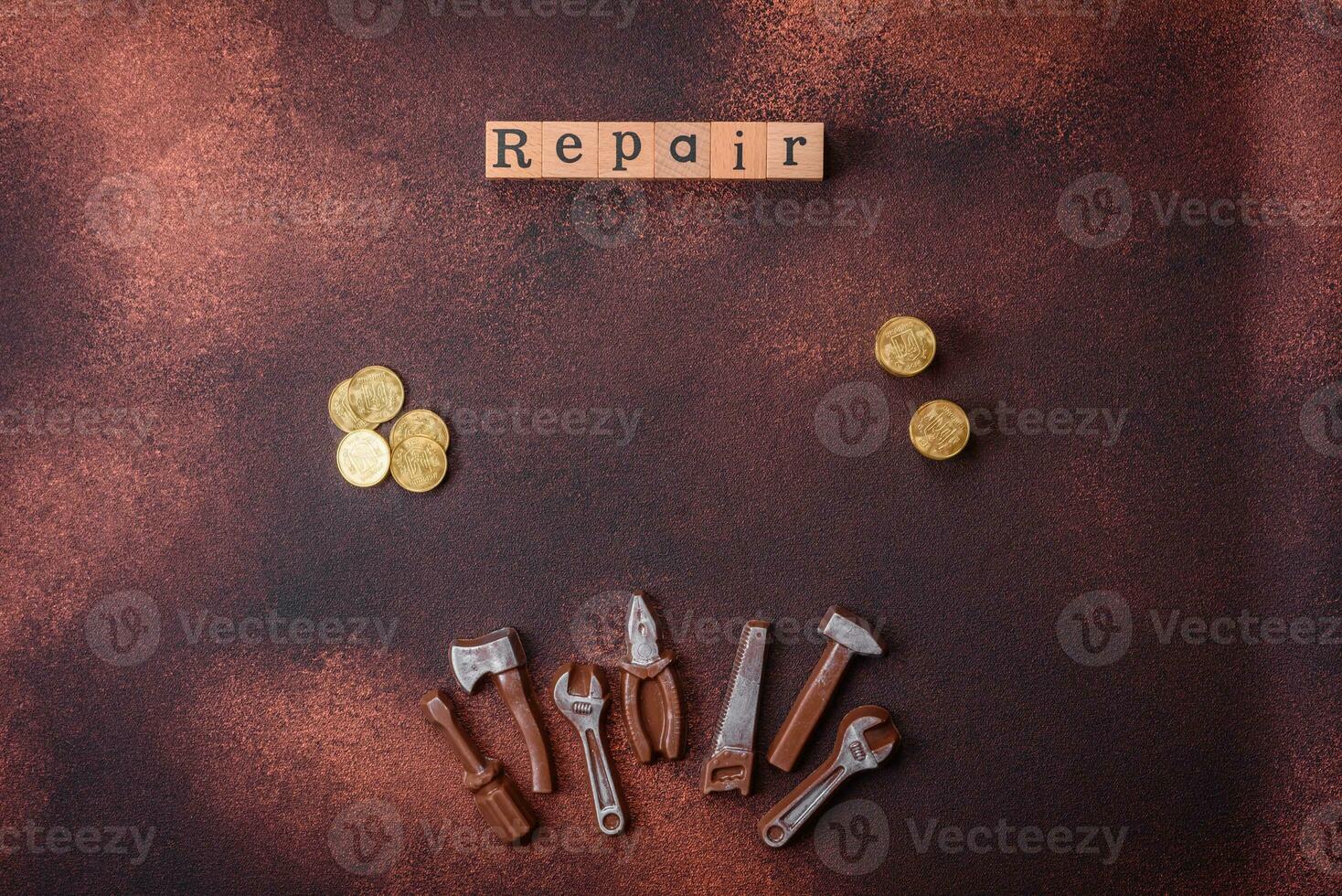 Tools and inscriptions symbolizing repairs or a garage and its attributes on a plain background photo