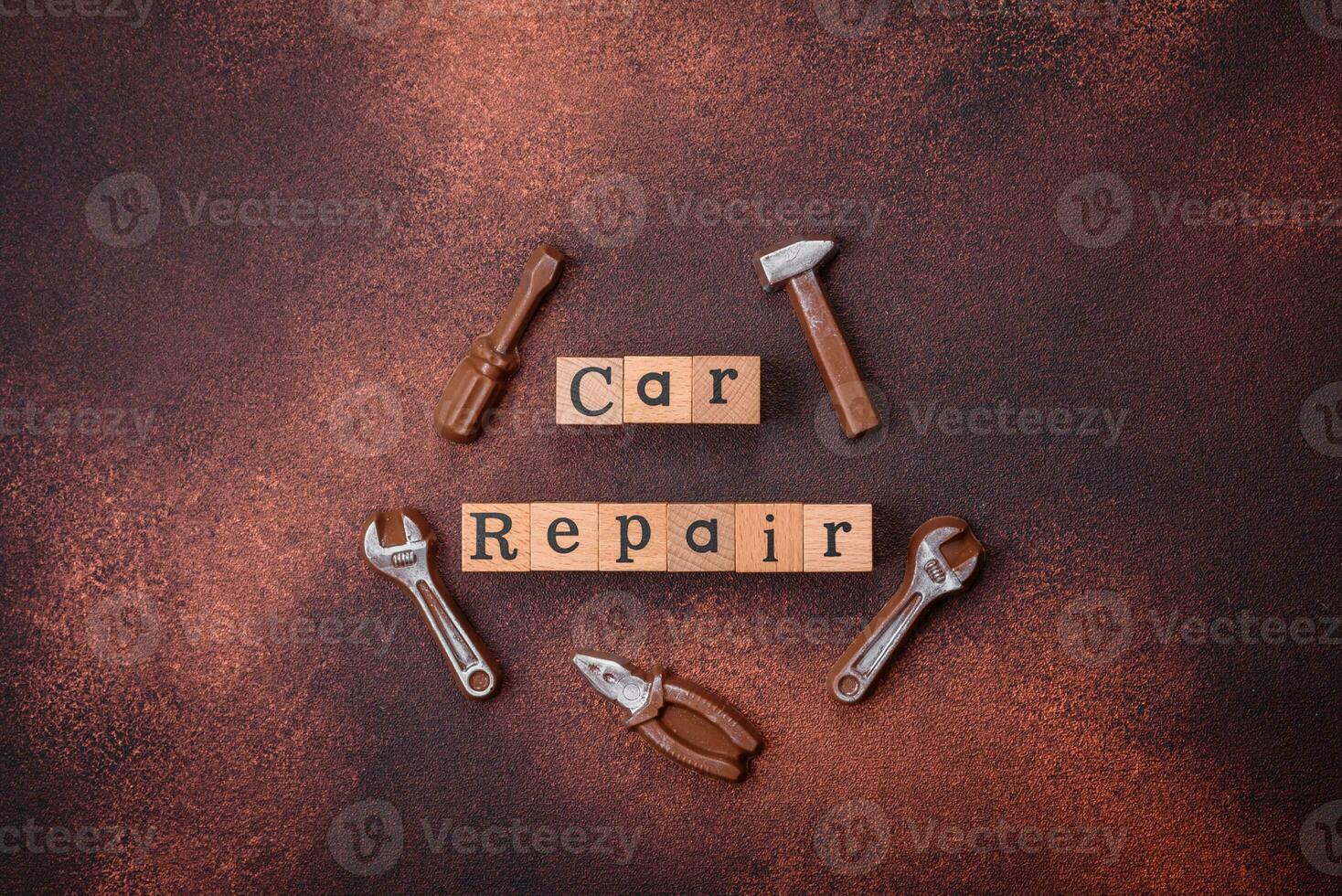 Tools and inscriptions symbolizing repairs or a garage and its attributes on a plain background photo