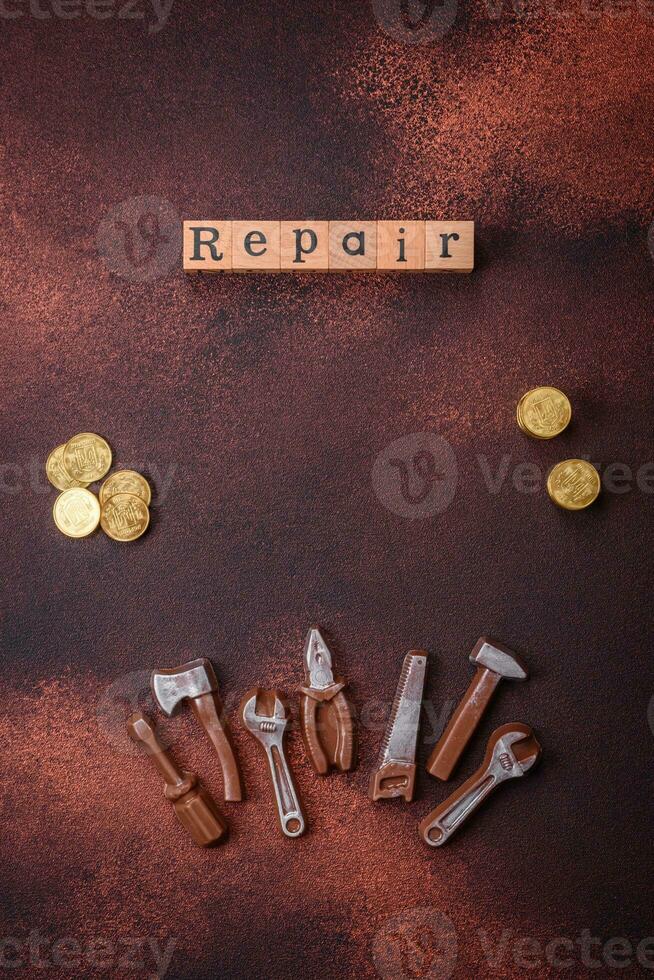 Tools and inscriptions symbolizing repairs or a garage and its attributes on a plain background photo