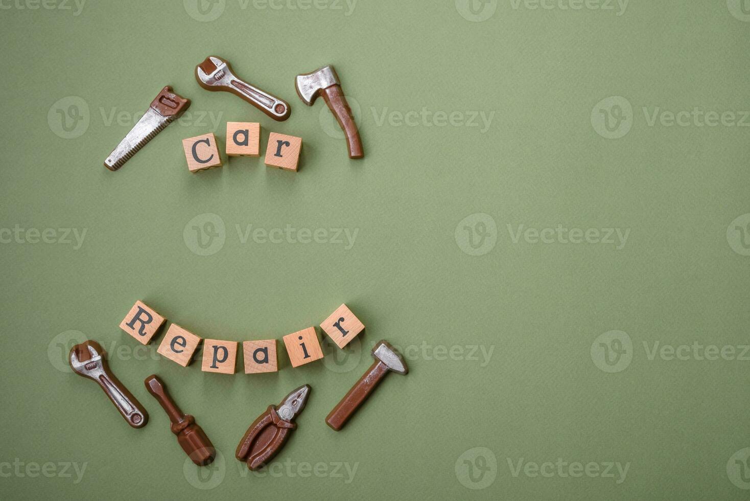 Tools and inscriptions symbolizing repairs or a garage and its attributes on a plain background photo