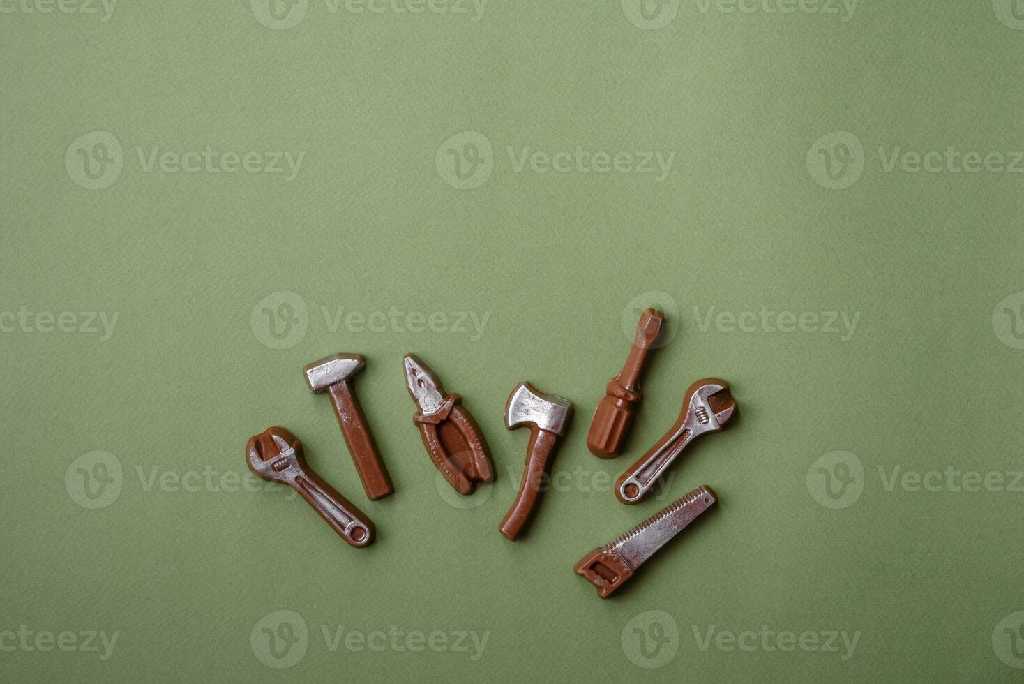 Tools and inscriptions symbolizing repairs or a garage and its attributes on a plain background photo