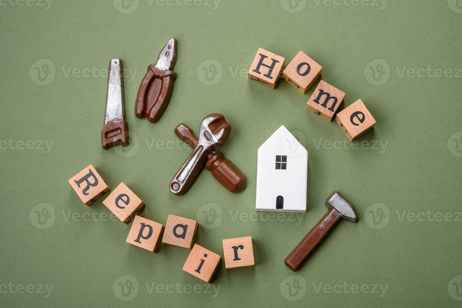 Tools and inscriptions symbolizing repairs or a garage and its attributes on a plain background photo