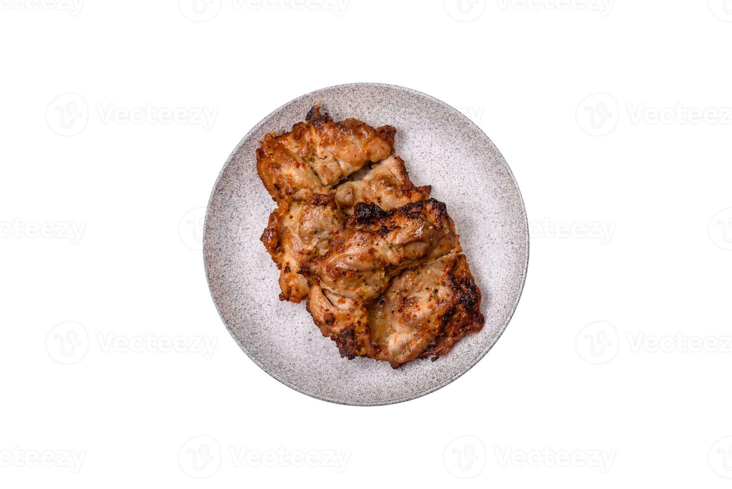 Delicious fresh crispy chicken grilled with salt, spices and herbs photo