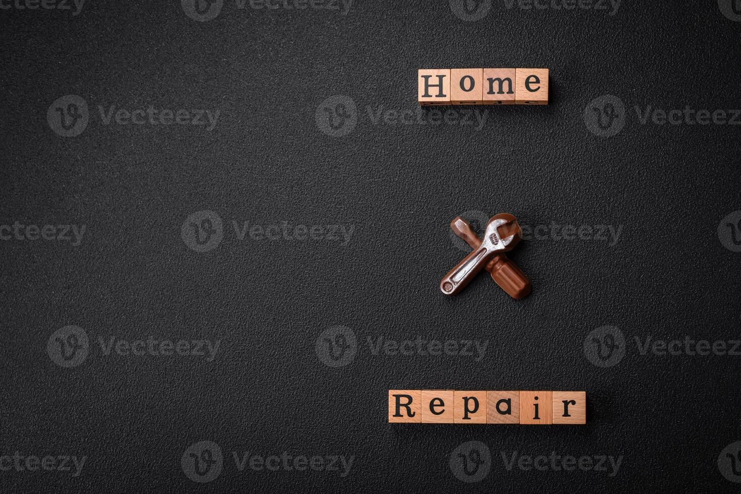 Tools and inscriptions symbolizing repairs or a garage and its attributes on a plain background photo