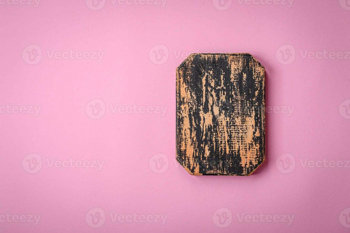 Empty wooden rectangular cutting board on a plain background, flatley with copy space photo