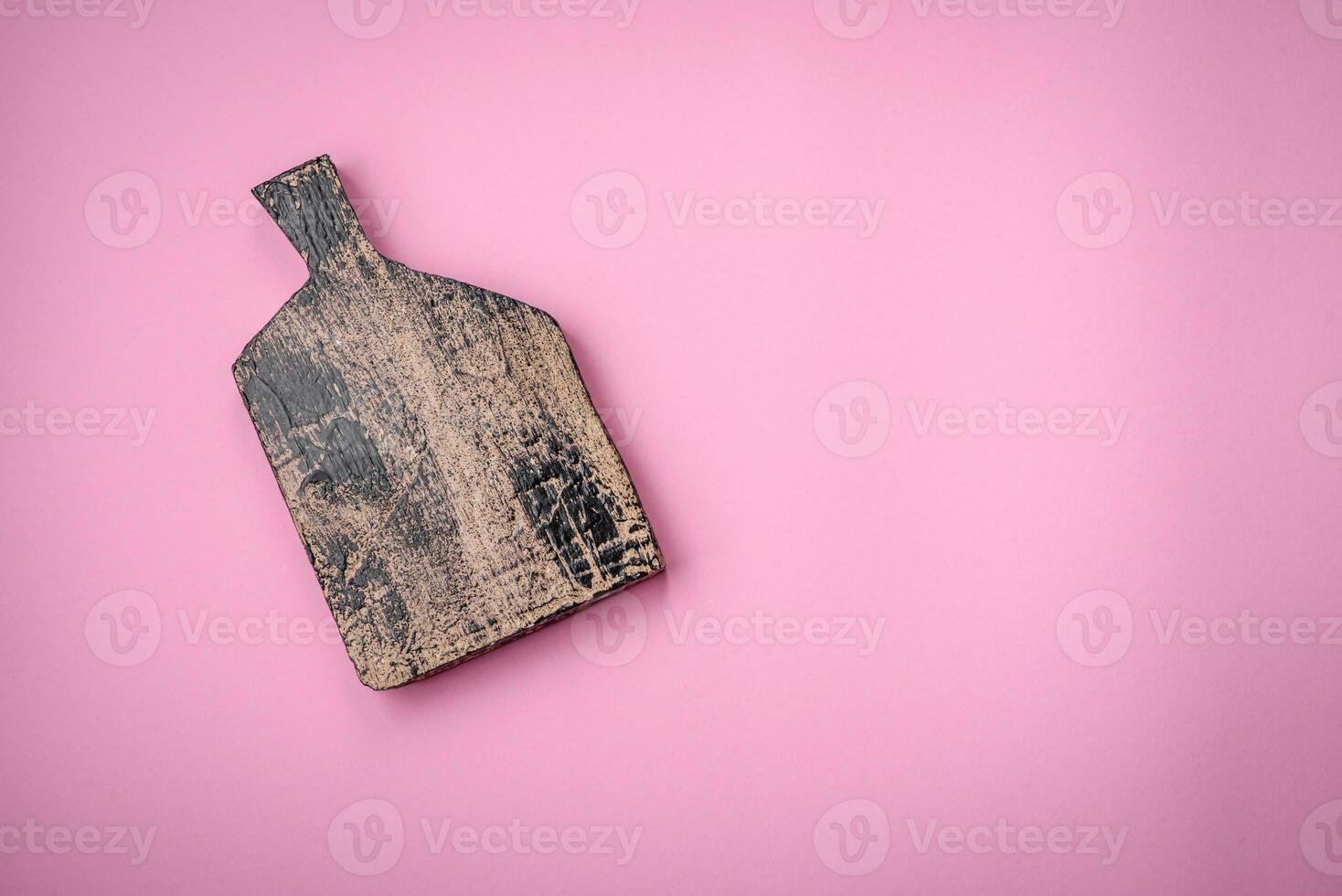 Empty wooden rectangular cutting board on a plain background, flatley with copy space photo