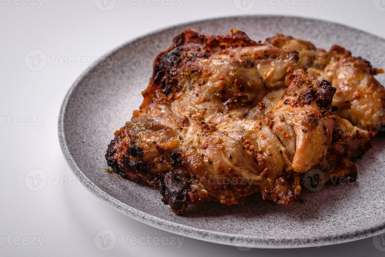 Delicious fresh crispy chicken grilled with salt, spices and herbs photo