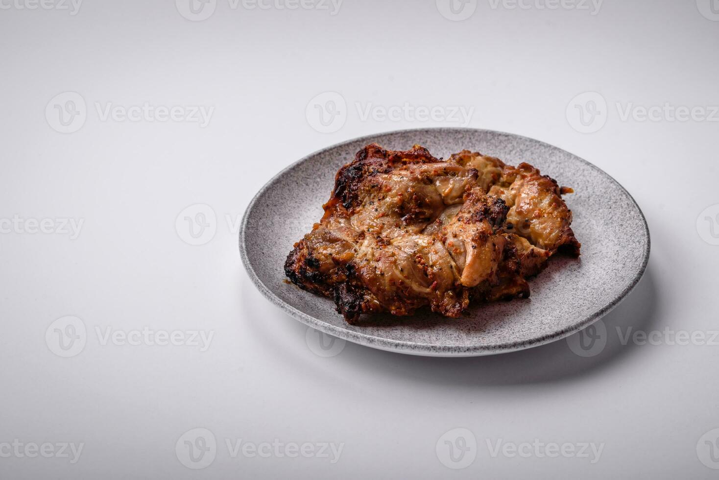 Delicious fresh crispy chicken grilled with salt, spices and herbs photo