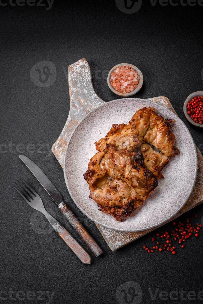 Delicious fresh crispy chicken grilled with salt, spices and herbs photo