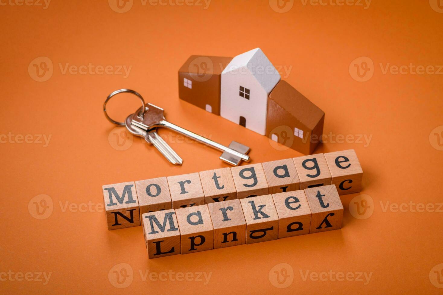 A small wooden house and keys as an idea for investing in your own home photo