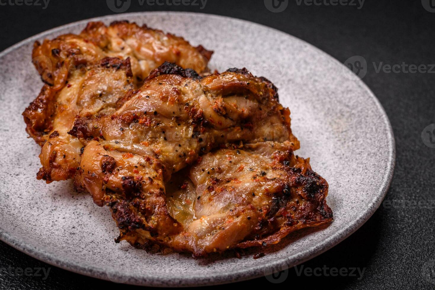 Delicious fresh crispy chicken grilled with salt, spices and herbs photo