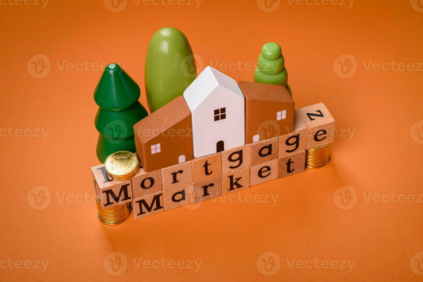 A small wooden house and keys as an idea for investing in your own home photo