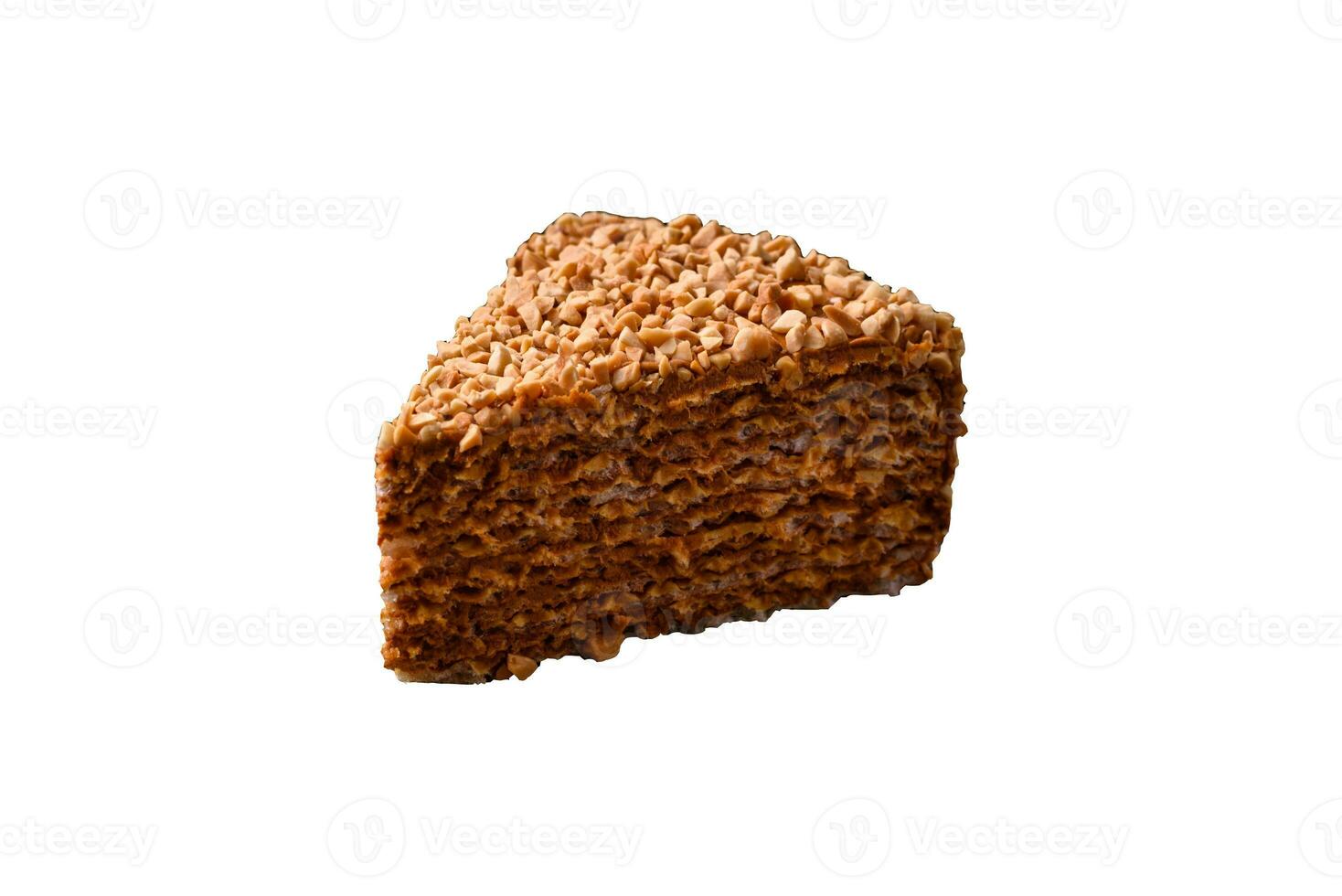 Delicious sweet puff waffle cake with cream and nuts cut into pieces photo