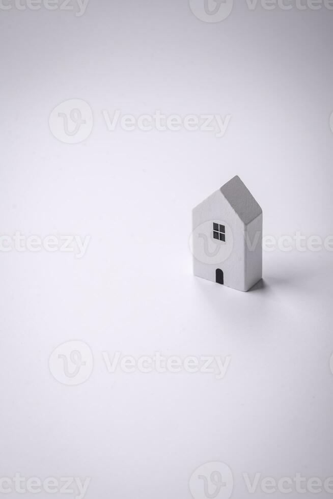 A small wooden house as an idea for investing in your own home and achieving the goal of buying real estate photo