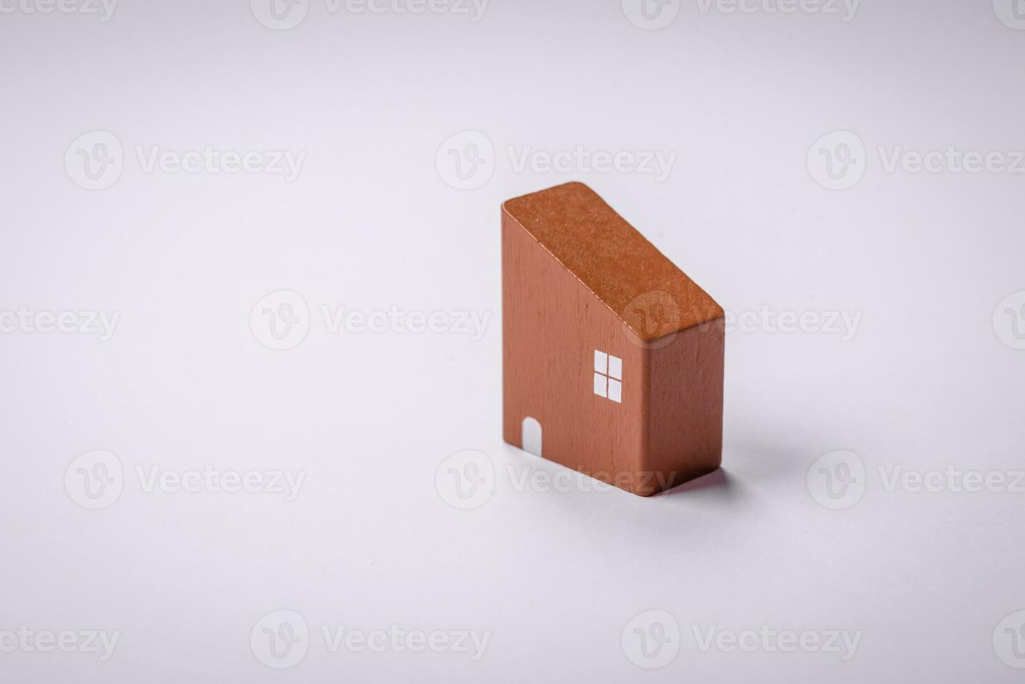 A small wooden house as an idea for investing in your own home and achieving the goal of buying real estate photo