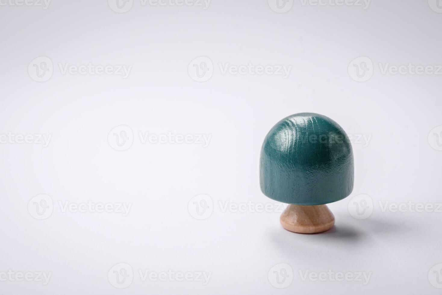 Wooden model of a tree with a green crown and trunk on a white background photo