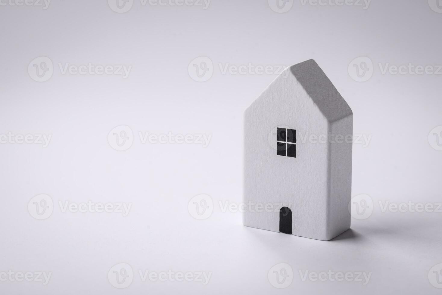 A small wooden house as an idea for investing in your own home and achieving the goal of buying real estate photo