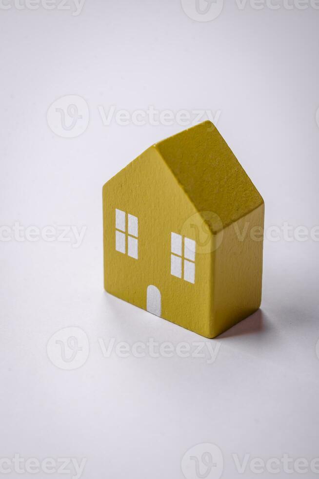 A small wooden house as an idea for investing in your own home and achieving the goal of buying real estate photo