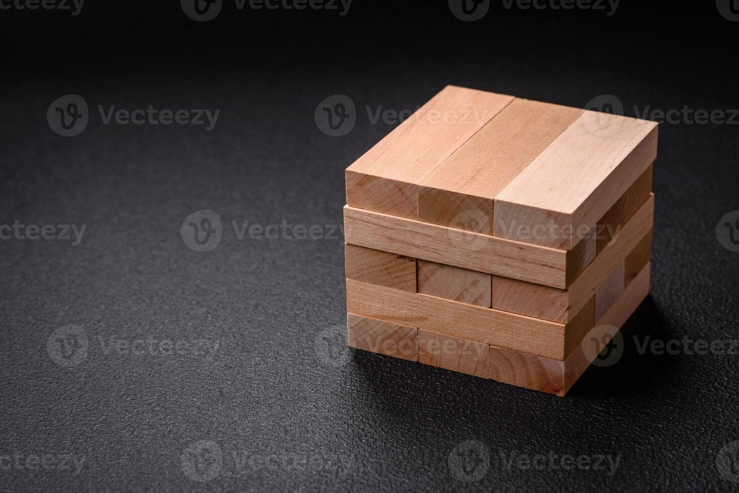 Wooden blocks of Jenga game as a concept idea of risk in achieving a goal photo