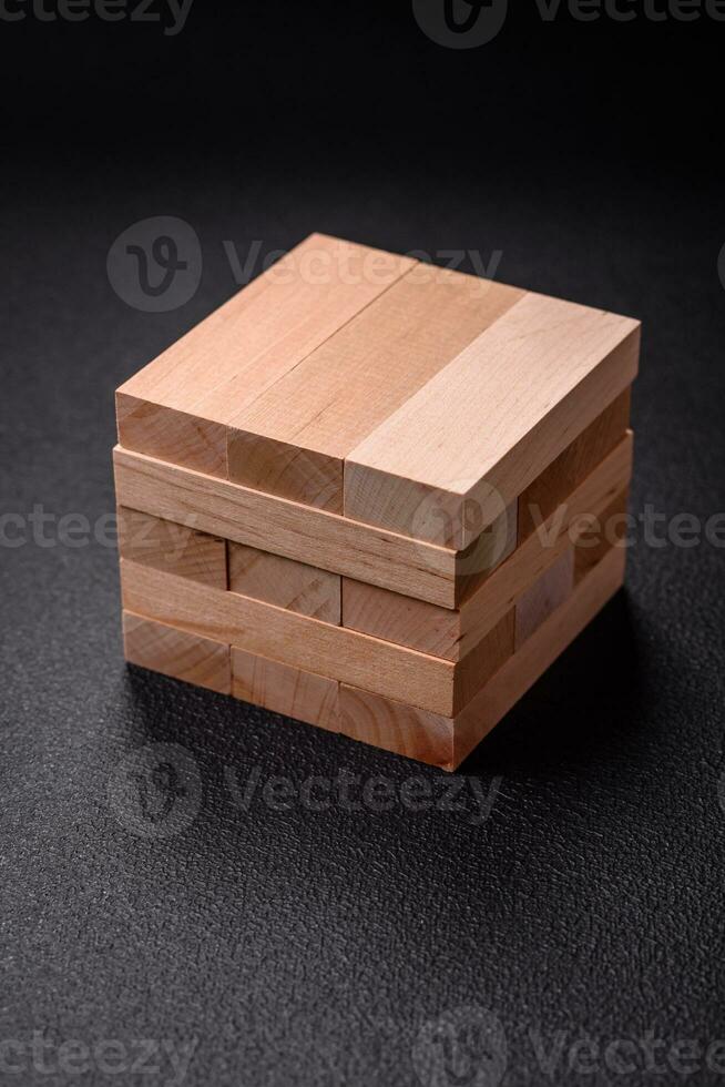 Wooden blocks of Jenga game as a concept idea of risk in achieving a goal photo