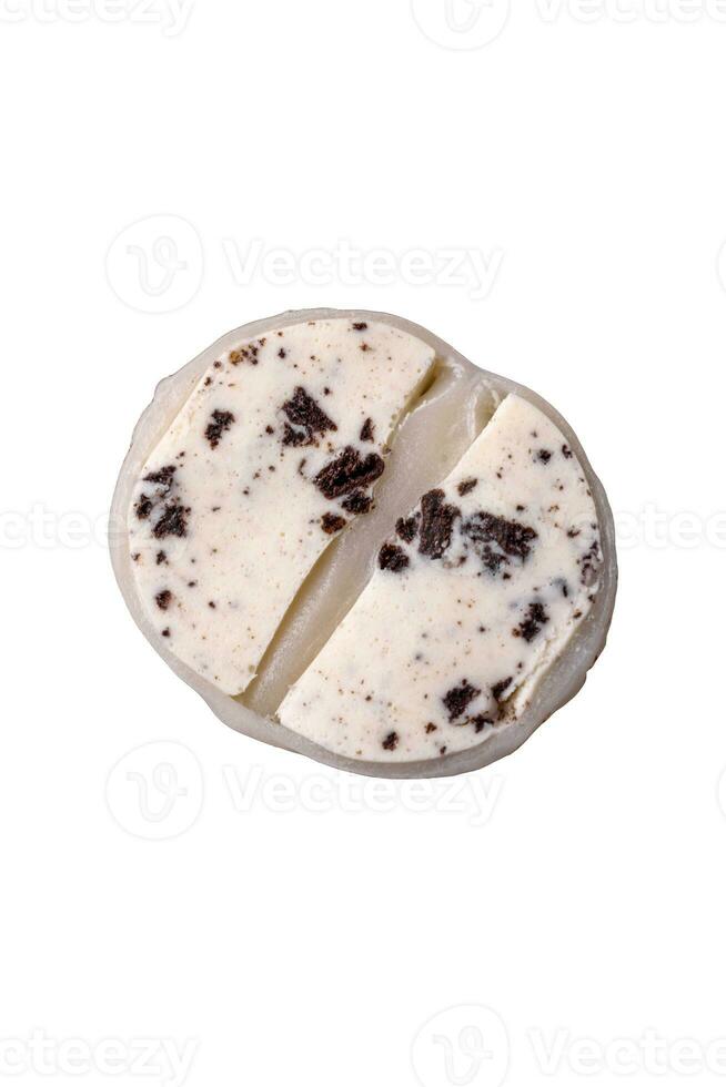 Delicious sweet mochi dessert with toppings on a dark concrete background photo