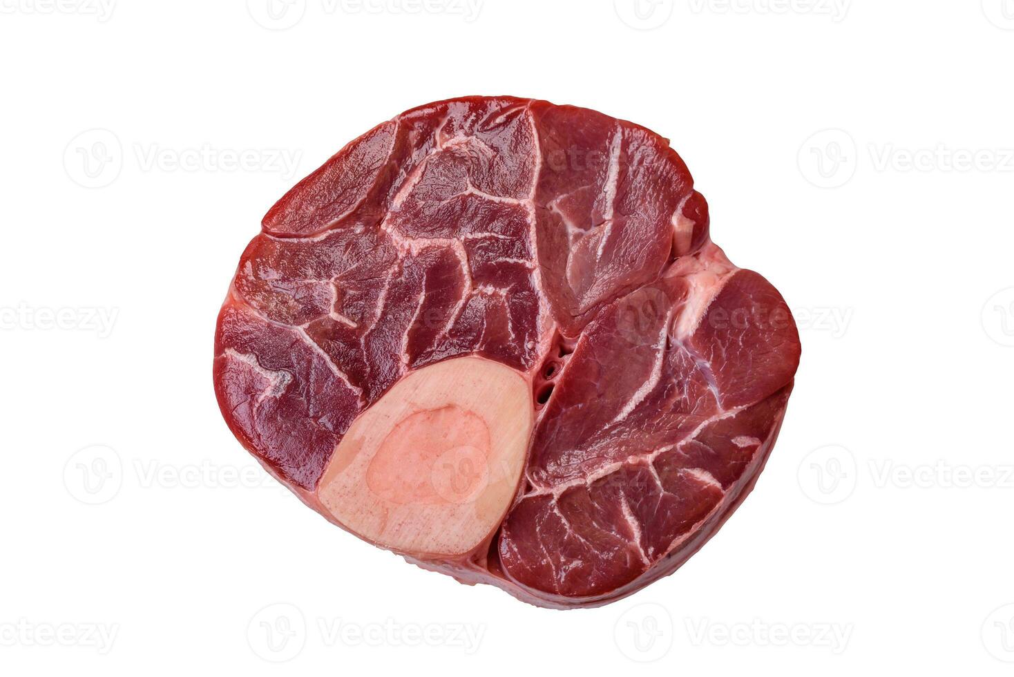 Fresh raw beef steak with bone or ossobuco with salt, spices and herbs photo