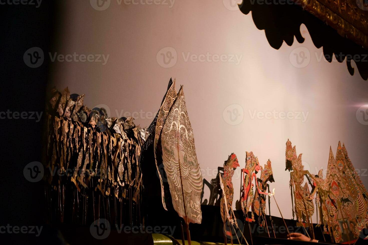 Wayang kulit or traditional javanese puppet is played on the stage photo