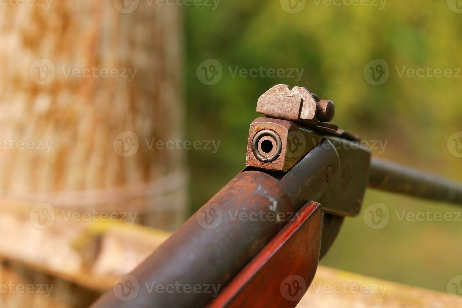 Close-up of a hunting rifle, with a shallow depth of field. photo