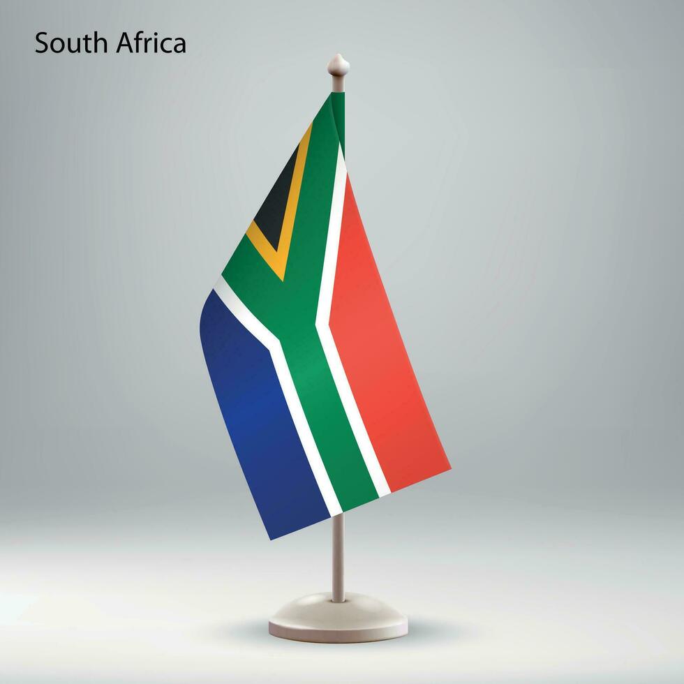 Flag of South Africa hanging on a flag stand. vector