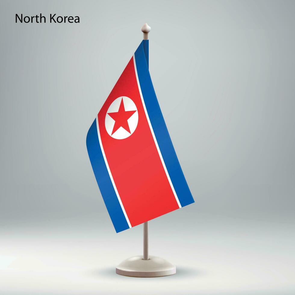 bandera de norte Corea colgando en un bandera pararse. vector