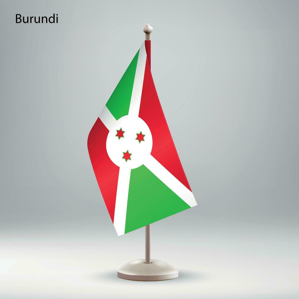 Flag of Burundi hanging on a flag stand. vector