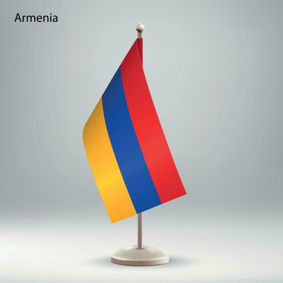 Flag of Armenia hanging on a flag stand. vector