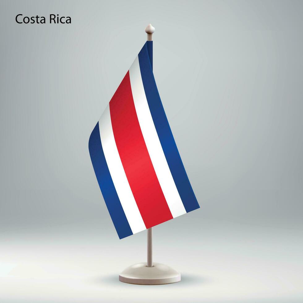 Flag of Costa Rica hanging on a flag stand. vector