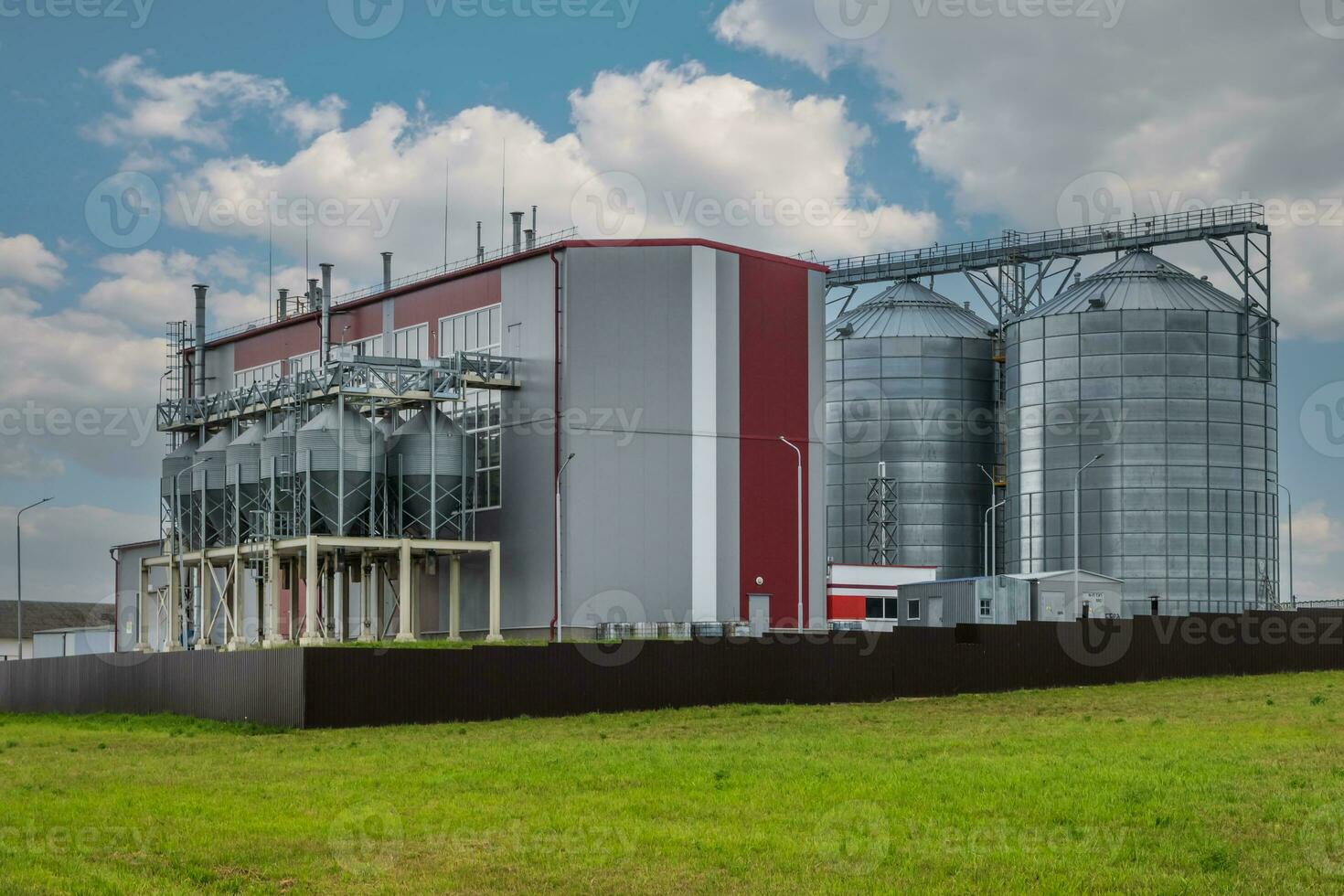 modern agro-processing plant for processing and silos for drying cleaning and storage of agricultural products, flour, cereals and grain photo