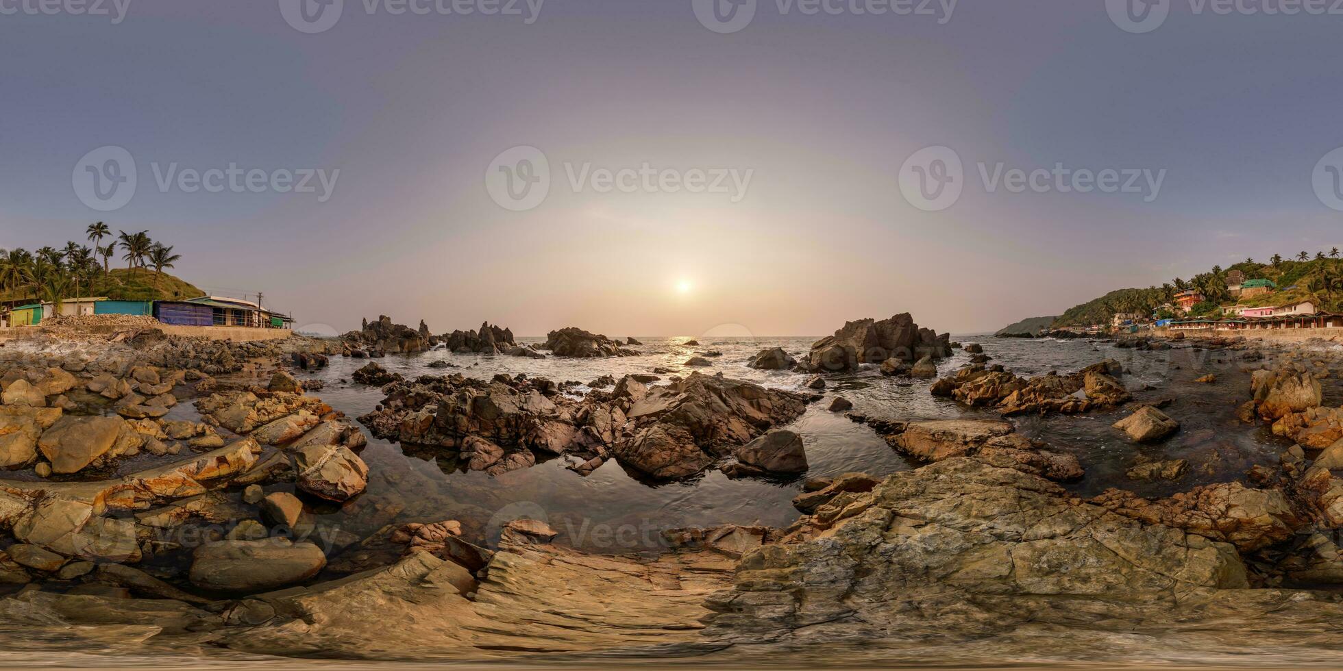 full hdri 360 panorama view on ocean on shore with rocks at sunset in equirectangular projection with zenith and nadir. VR AR content photo