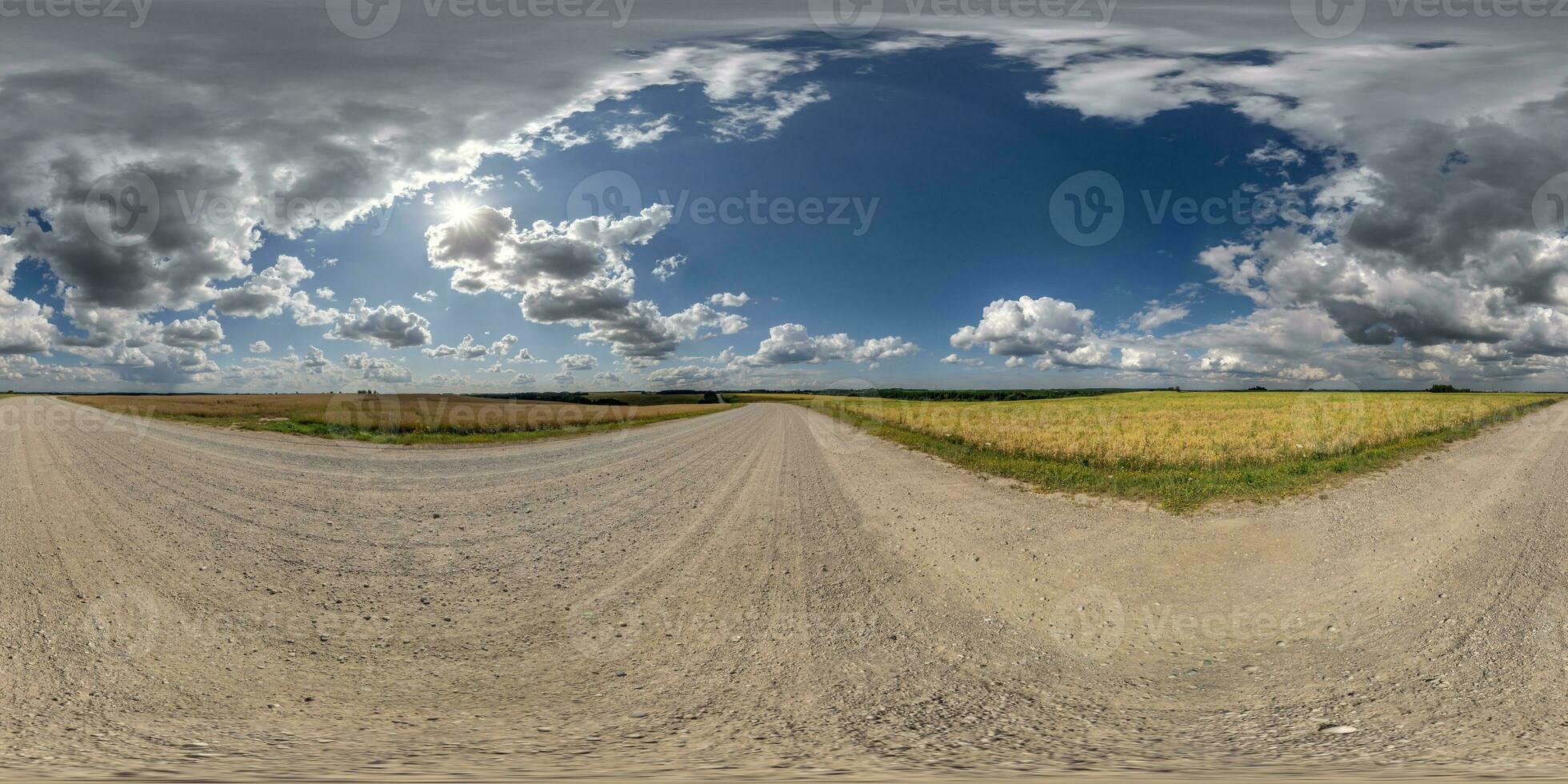 360 hdri panorama on gravel road with marks from car or tractor tires with clouds on blue sky in equirectangular spherical  seamless projection, skydome replacement in drone panoramas photo