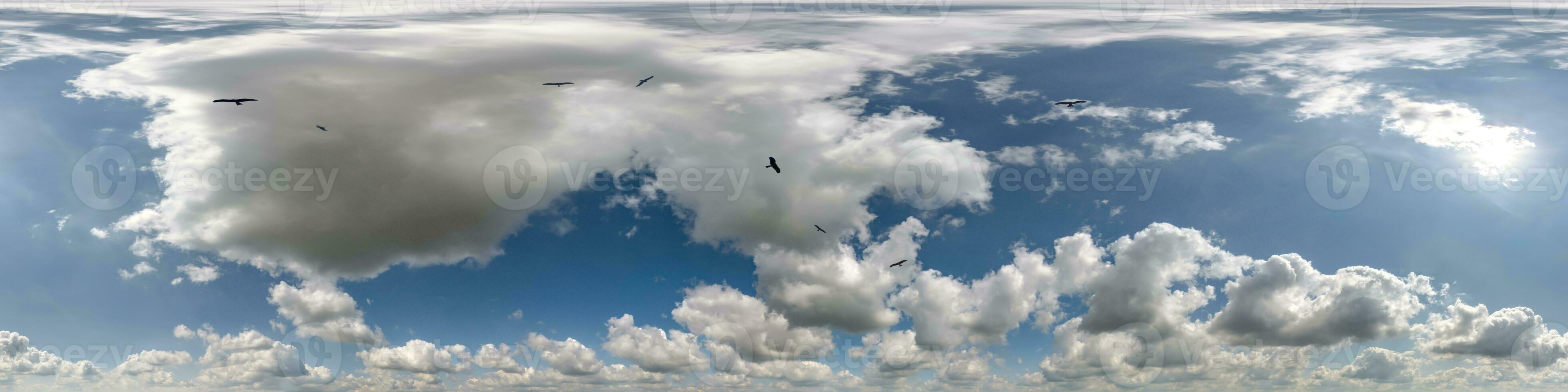 seamless cloudy blue skydome 360 hdri panorama view with flock of birds in awesome clouds with zenith for use in 3d graphics or game as sky dome or edit drone shot photo