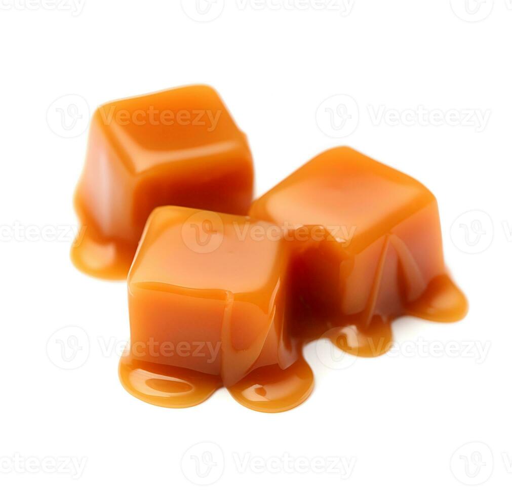 Caramel candy with topping on white backgrounds photo