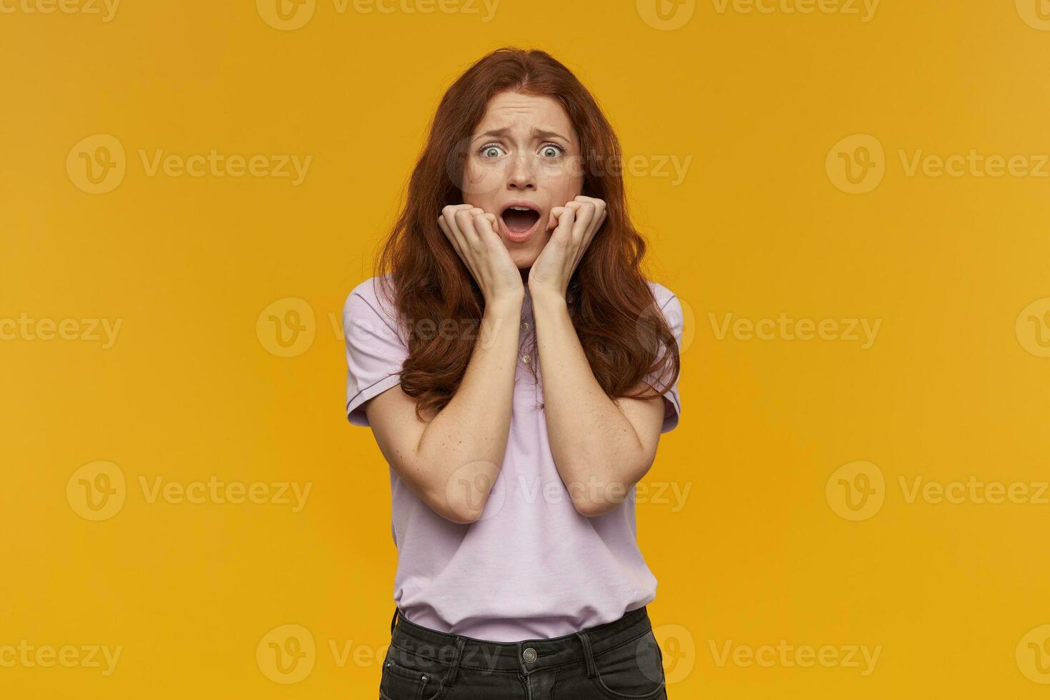 girl standing over yellow background photo