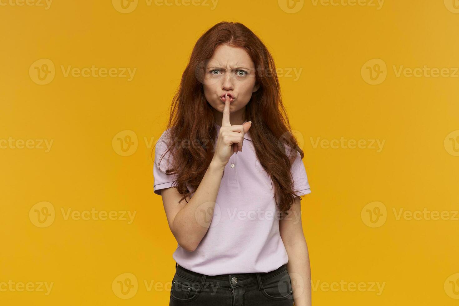 girl standing over yellow background photo