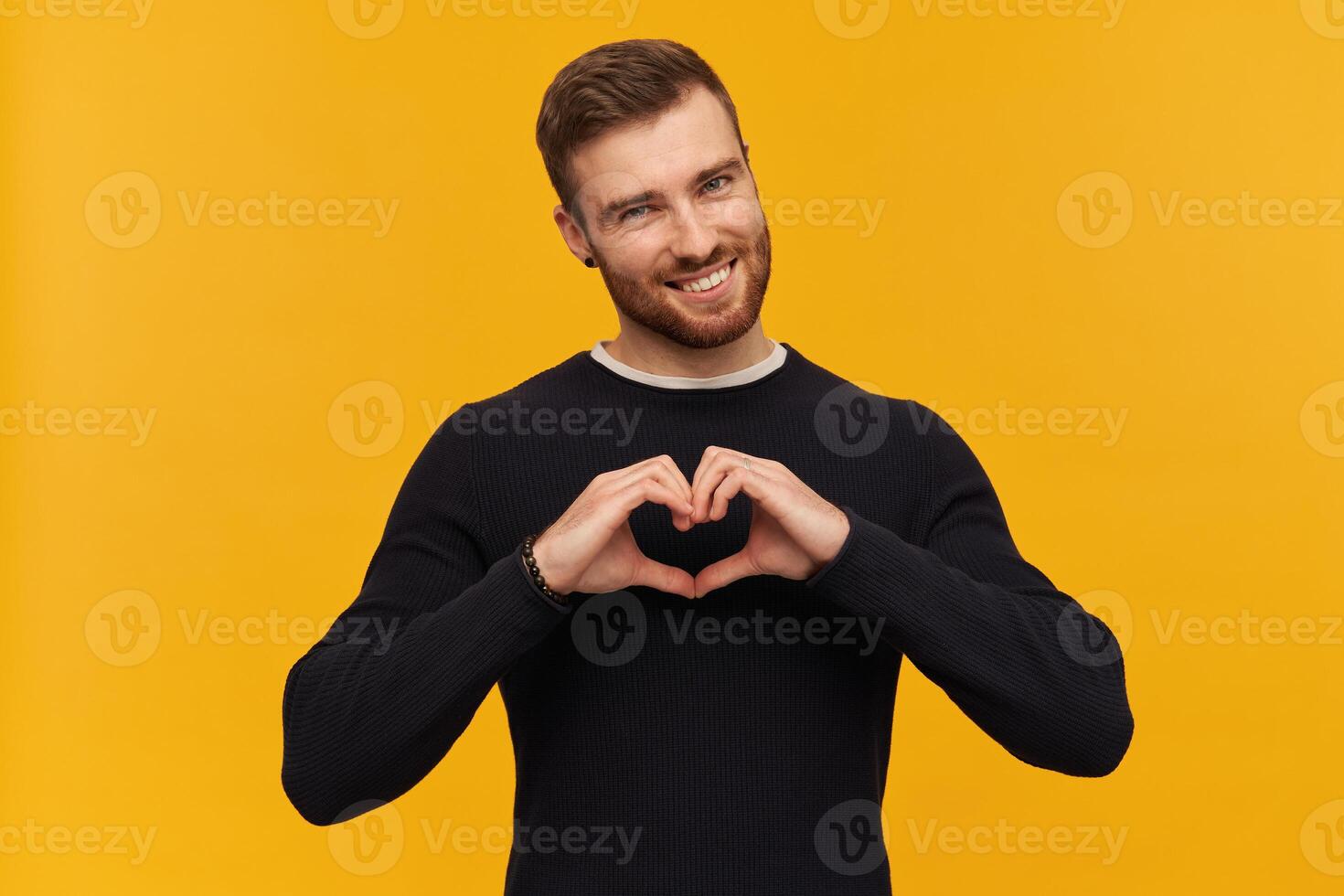 Charming male, handsome guy with hair and beard. Has piercing