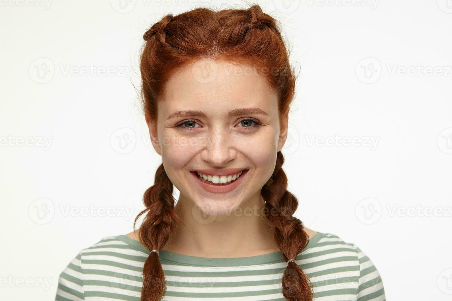 young positive ginger young female smiling photo