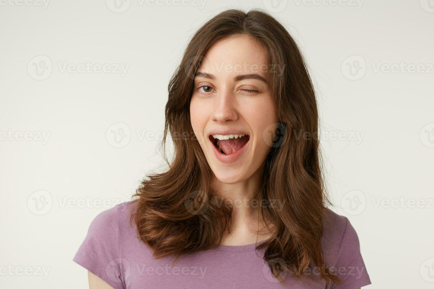 Close up photo of sweet heartbreaking darkhaired pretty girl, flirting with new boyfriend, winks at him., isolated over white studio background