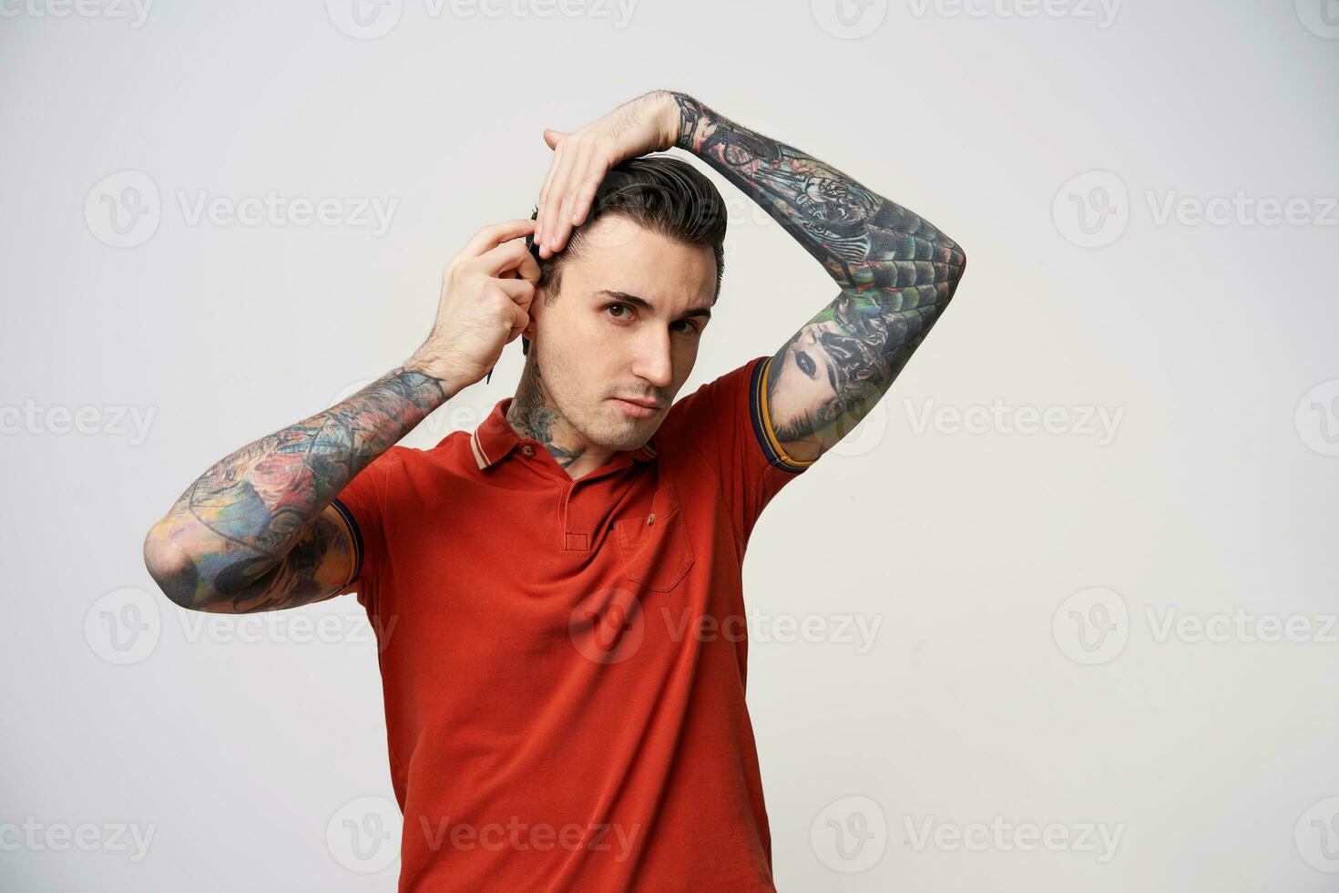 young male standing over white background photo