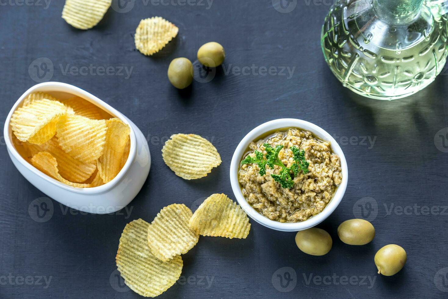 Potato chips with olive pate photo